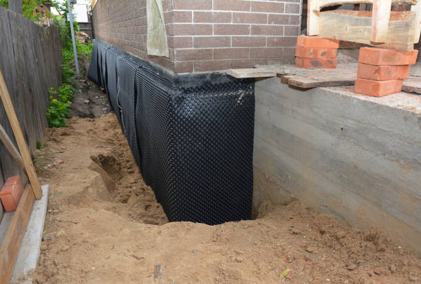 Happy homeowners after waterproofing job in Liberty